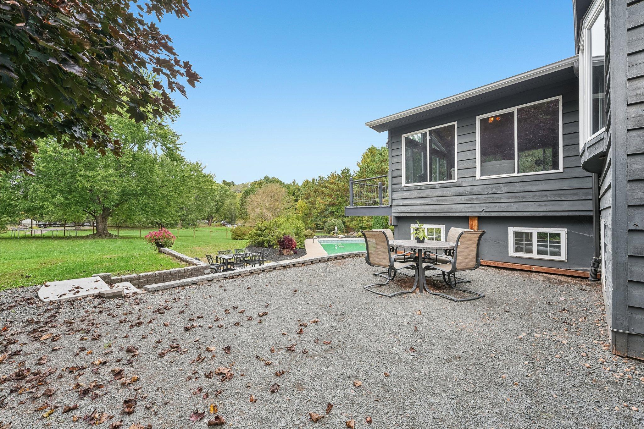 Upper patio with steps to lower patio and pool