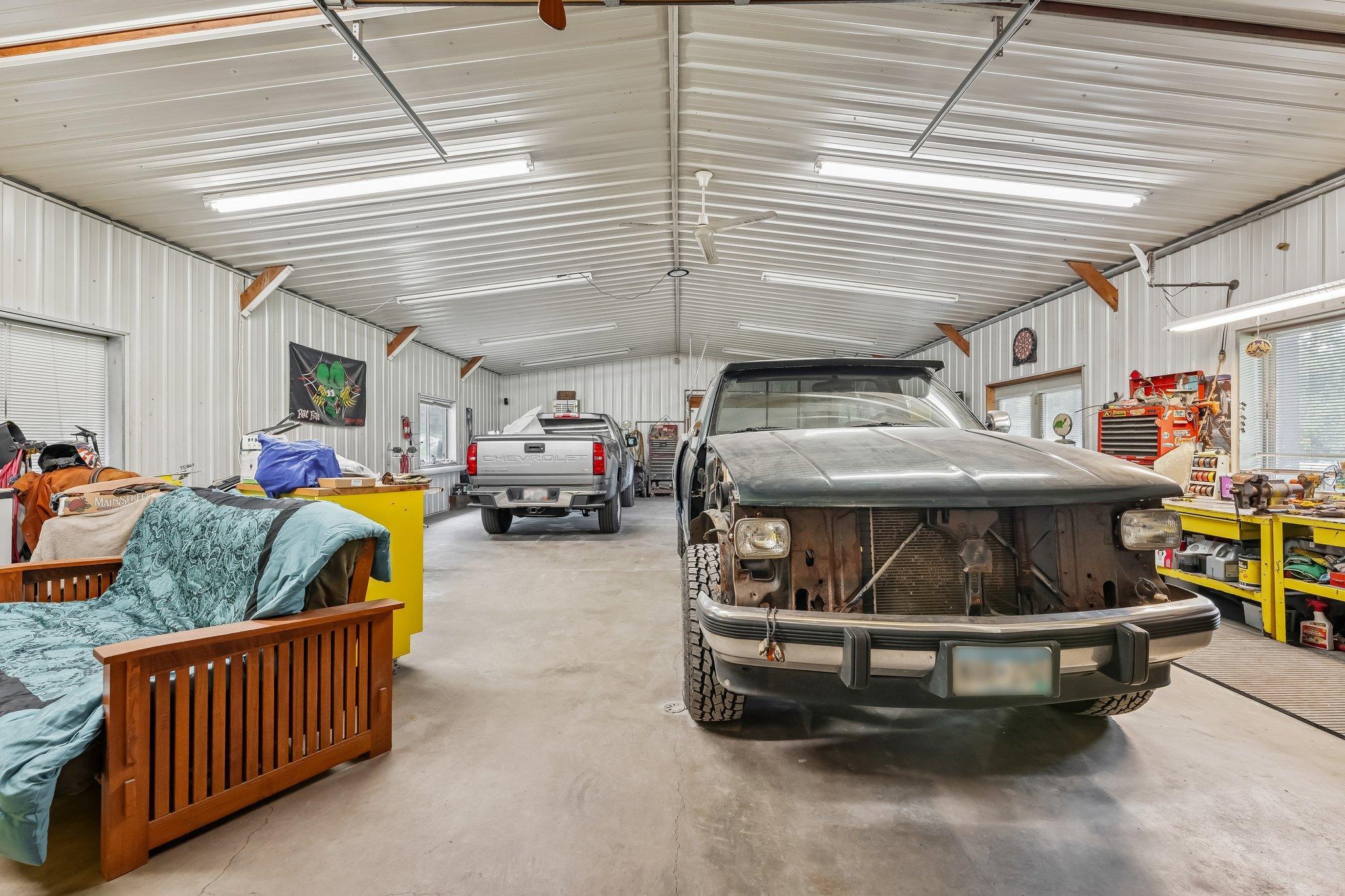 44' x 30 Insulated heated shop of the 30 x 99 pole shed with patio door leading to covered patio and windows