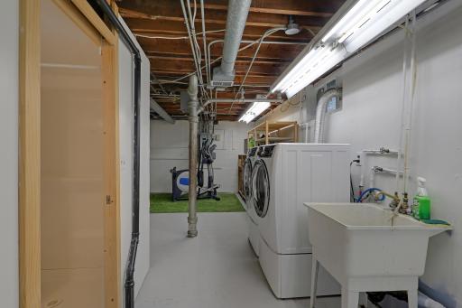Functional lower-level utility space with work surfaces and room for storage and projects.