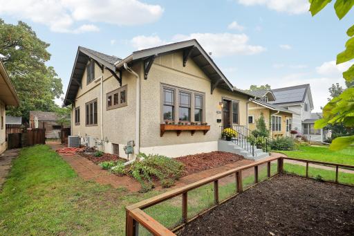 Established perennial gardens and a brick walkway complement the homeâs charming exterior.