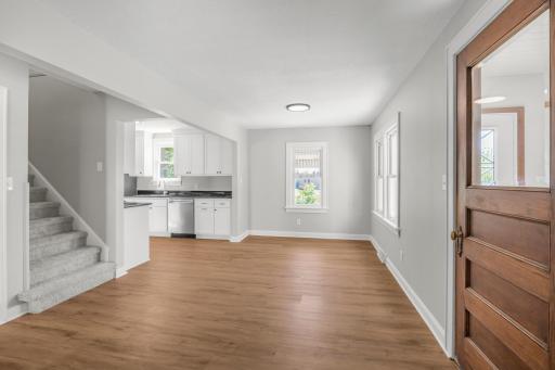 View of the dining space in this open floor plan from the front door