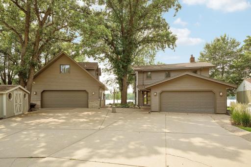 This property features a large concrete driveway leading to the attached as well as the detached garages with plenty of parking for visitors, which you will certainly get here.
