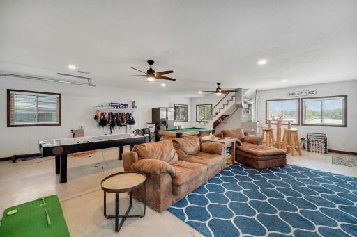 Sit back, relax, and watch the game or play a round of pool or air hockey. The detached garage is currently set up as a game room with epoxy floors and its own furnace.