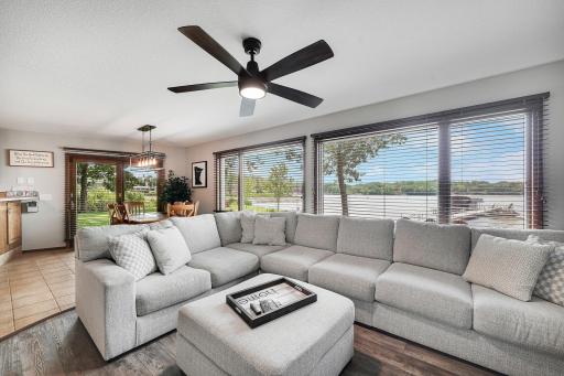 An entire wall of windows look out towards the West facing views of Cedar Lake, one can never get tired of this view!