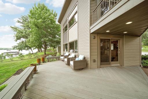 Huge maintenance free deck off the dining room with built in benches and great landscaping.
