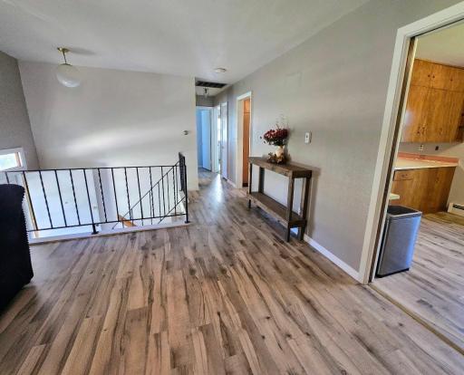LVP flooring in living room, hallway, kitchen & dining rooms