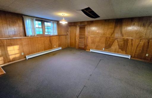 Door to stairs to garage and boiler room.