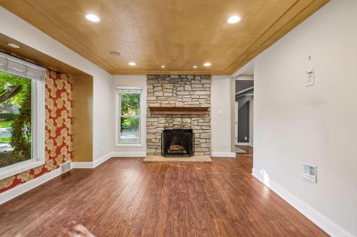 Main level living room with wood burning fireplace