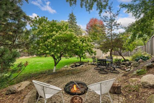 Private back yard patio with fire pit and fountain