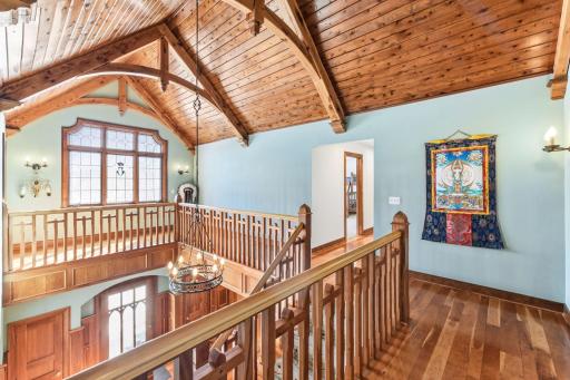 Upper landing is functional and a visual treat streaming with natural light