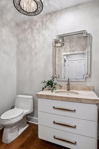 Centrally located half bath offers convenience for residents and guests.