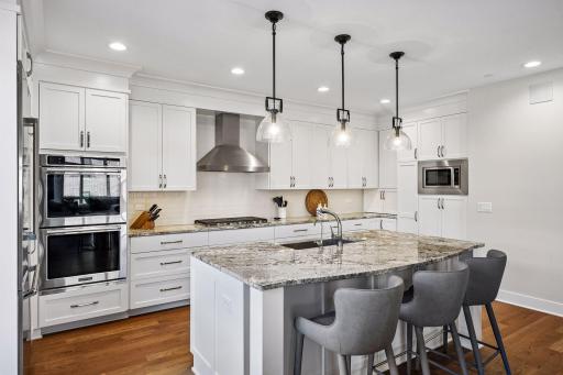 Kitchen features a sit-up bar perfect for casual dining.