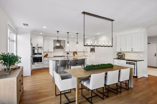 Spacious informal dining room perfectly positioned at the heart of the condo, offering easy access to the patio and kitchen.