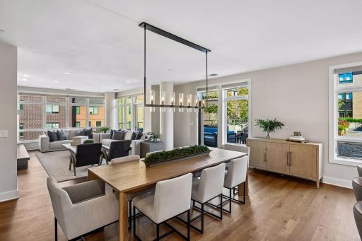Walls of windows fill this corner unit with natural light and create a beautiful connection to the outdoors.