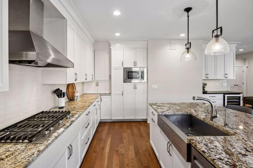 Kitchen features stainless steel appliances and an open layout that connects beautifully with the living and dining areas.