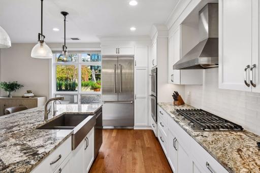 Kitchen features stainless steel appliances and an open layout that connects beautifully with the living and dining areas.