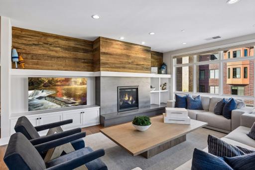 Living room is anchored by a cozy gas fireplace.