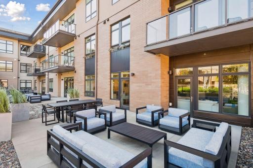 Two private patios totaling approximately 600 sq. ft. offer exceptional outdoor living space. Located along the courtyard, enjoy easy access across the courtyard to the second-floor Club Room, creating a unique opportunity for expanded entertaining.