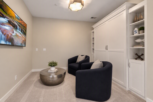 Den with Murphy bed provides flexible space for a home office, guest room, or everyday living.