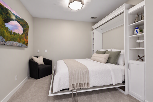 Den with Murphy bed provides flexible space for a home office, guest room, or everyday living.
