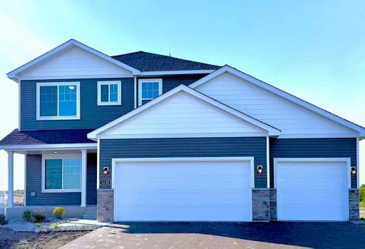 3135 Jandura Ave NE- New Construction Home ready for a Quick Move-in! Highlights include a 4 Bay Garage (934 sq. ft.) and Front Porch located on a Walkout Homesite! Sod will be installed soon.