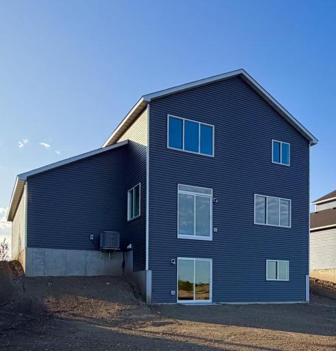 3135 Jandura Ave NE- Rear elevation features a walkout lower level to spacious backyard. Sod and irrigation system included.