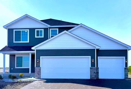 3135 Jandura Ave NE- New Construction Home ready for a Quick Move-in! Highlights include a 4 Bay Garage (934 sq. ft.) and Front Porch located on a Walkout Homesite! Sod will be installed soon.