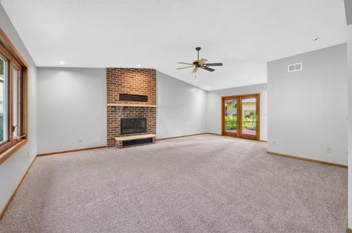 Amazing, large living room on the main floor with doors out to a back deck
