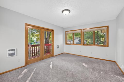Wonderful sun room with door out to the backyard