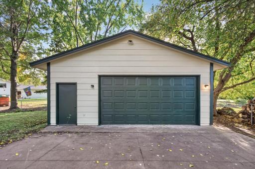 In addition to the 2 stall attached garage is this finished detached garage that could fit 4+ cars, house an amazing workshop or be used for additional storage...the possibilities are endless!
