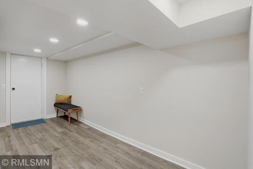 Spacious lower level mud room is ready for your decorating ideas!