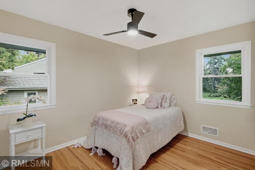 Captivating bedrooms have original hardwood floors