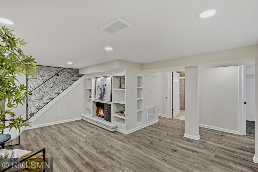 Built in shelving in the lower level and brand new recess lighting