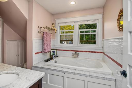 Primary bath room with tub and it's own hot water heater