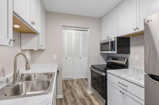 Ample countertop and cabinet space in this efficiency kitchen.