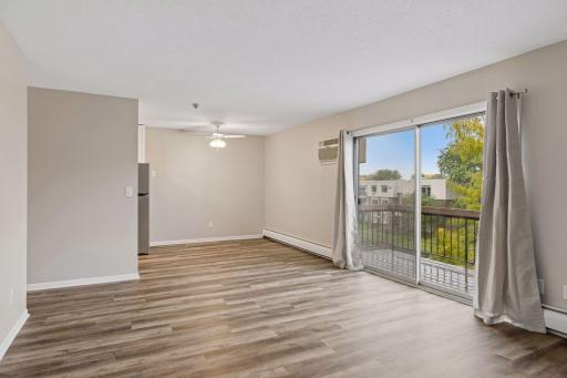 Abundant natural light through the patio doors and bedroom windows.