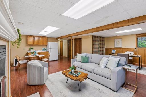 Note wet bar type area in family room with sink and fridge