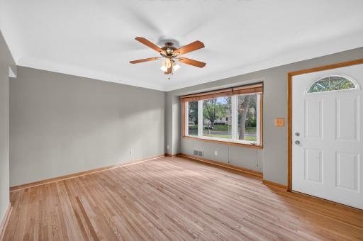Enter into the spacious living room with an oversized picture window bringing in beautiful natural light!