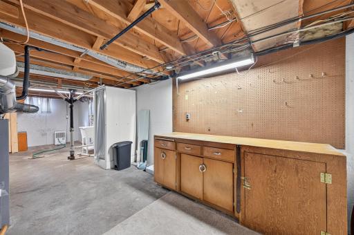 The basement also features a workbench and ample storage space.