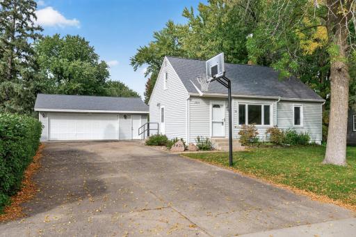 2+ car garage, a basketball hoop, and large driveway with ample room for guest parking!