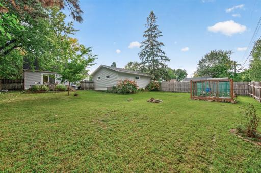 The oversized backyard has plenty of space to garden, grill out, and play!