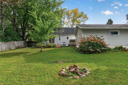 The yard is fully fenced with a privacy fence.