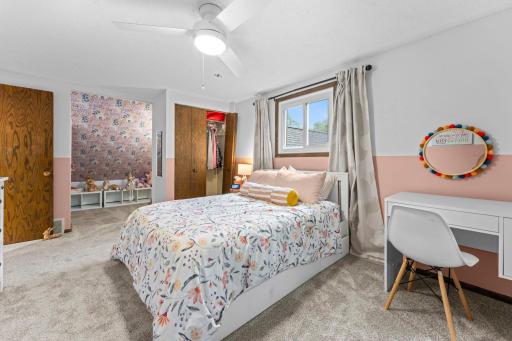 Upper level bedroom features a closet and adorable reading/play nook