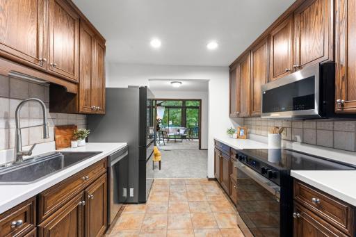 Alternate view of the kitchen, leading to the flex space and 3 season porch
