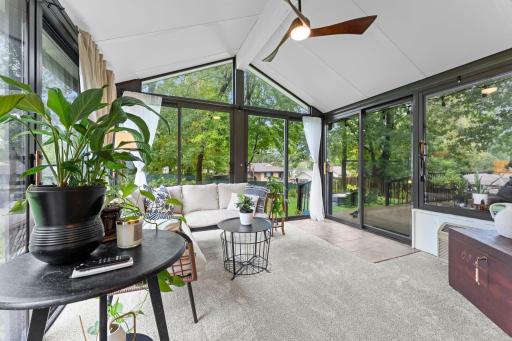Stunning 3 season porch (with heater!) overlooking the fenced in backyard
