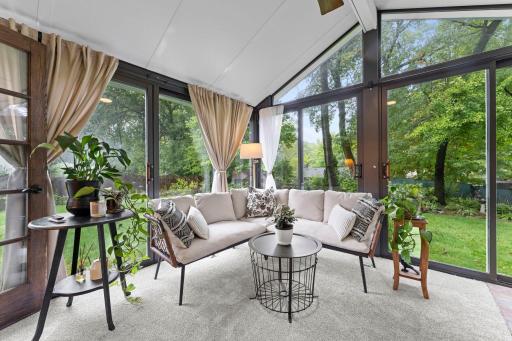 Stunning 3 season porch (with heater!) overlooking the fenced in backyard