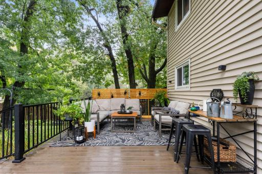 Maintenance free decking, off the 3 season porch, overlooking the fenced-in backyard