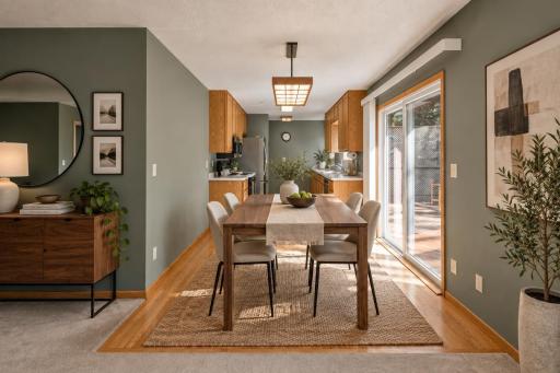 Dining Room and Kitchen with hardwood floors (virtually staged)