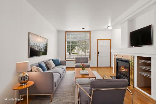 Living and foyer entry view - virtually staged.