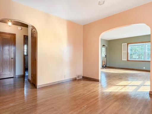 Dining room leads to living room, adjacent to bedrooms and hallway